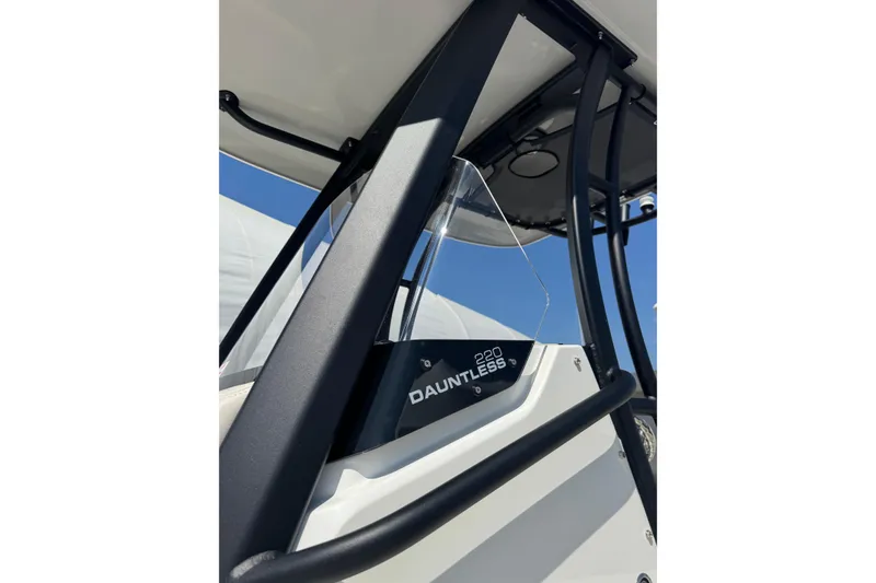 Slide: The Image of 2026 Boston Whaler 220 Dauntless boat detail with sleek design and sturdy frame. - 17
