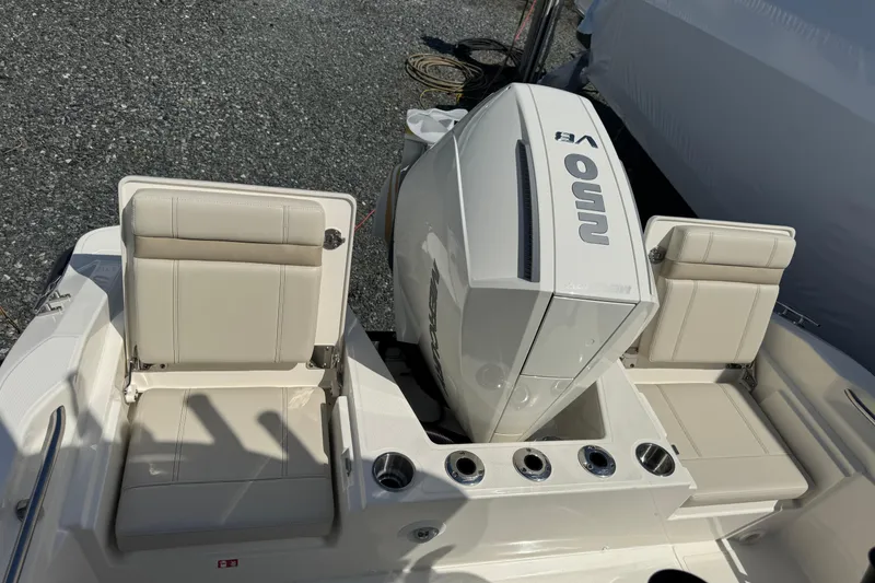 Slide: The Image of 2026 Boston Whaler 220 Dauntless boat with seating and engine view. - 7