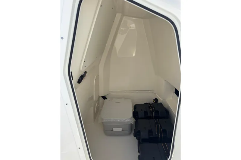 Slide: The Image of Interior storage compartment of 2026 Boston Whaler 220 Dauntless boat. - 8