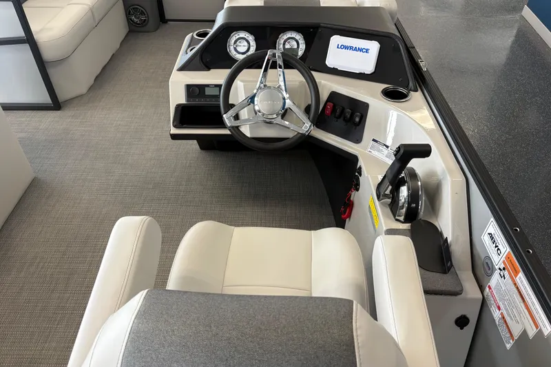 Slide: The Image of Rear view of a 2026 Crest 180 SE pontoon boat in showroom. - 1