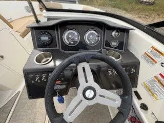 Slide: The Image of Dashboard of 2023 Bayliner VR5 Bowrider I/O with steering wheel and gauges. - 10