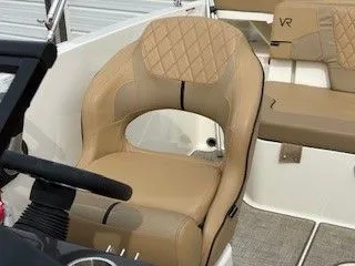 Slide: The Image of 2023 Bayliner VR5 Bowrider I/O, beige leather seat with steering wheel. - 12