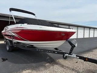 Slide: The Image of 2023 Bayliner VR5 Bowrider I/O in red on trailer. - 17