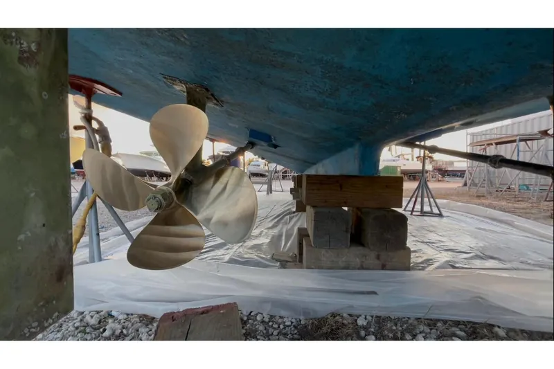 Slide: The Image of 1989 Topaz 44 Sportfisherman boat propeller and hull on dry dock. - 32