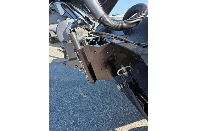 Slide: The Image of Close-up of Excel EX 183 boat motor mount, 2026 model, on asphalt surface. - 11