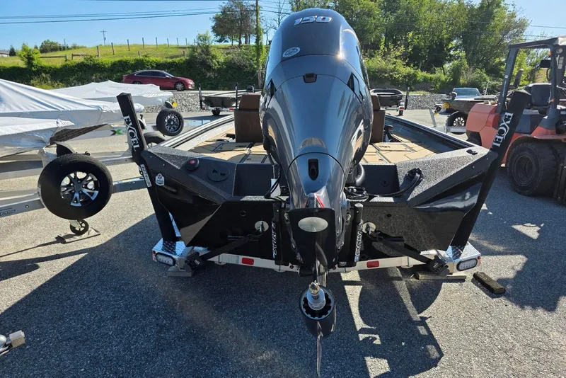 Slide: The Image of 2026 Excel EX 183 boat with powerful outboard motor on trailer. - 12