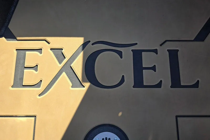 Slide: The Image of Excel EX 183 logo on a tan surface, 2026 model. - 14