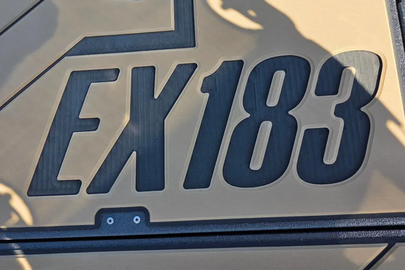 Slide: The Image of Close-up of Excel EX 183 model logo, 2026 design, with shadow overlay. - 20
