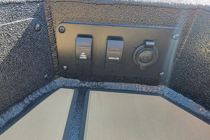 Slide: The Image of Control panel of Excel EX 183 boat, featuring trim and navigation switches, 2026 model. - 23