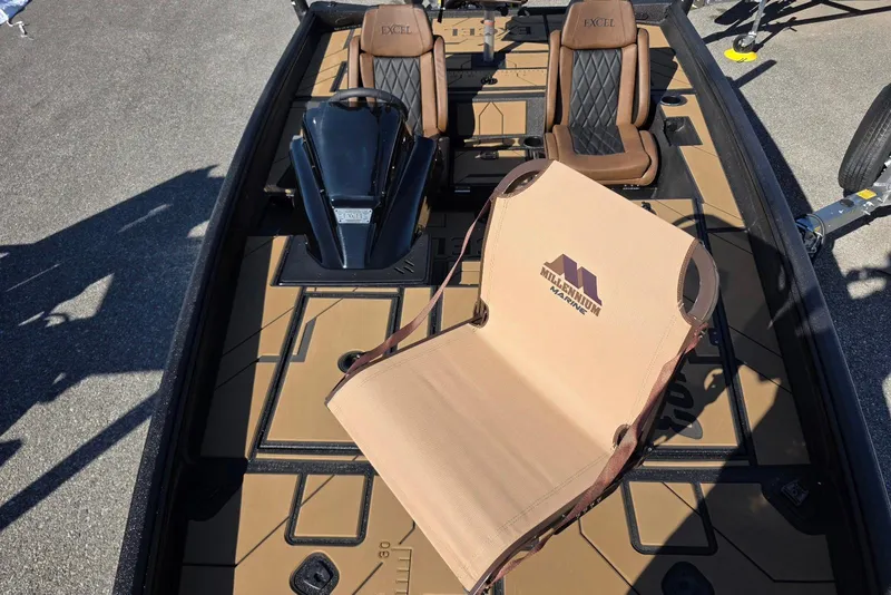 Slide: The Image of 2026 Excel EX 183 boat interior with brown seating and Millennium Marine chair. - 24