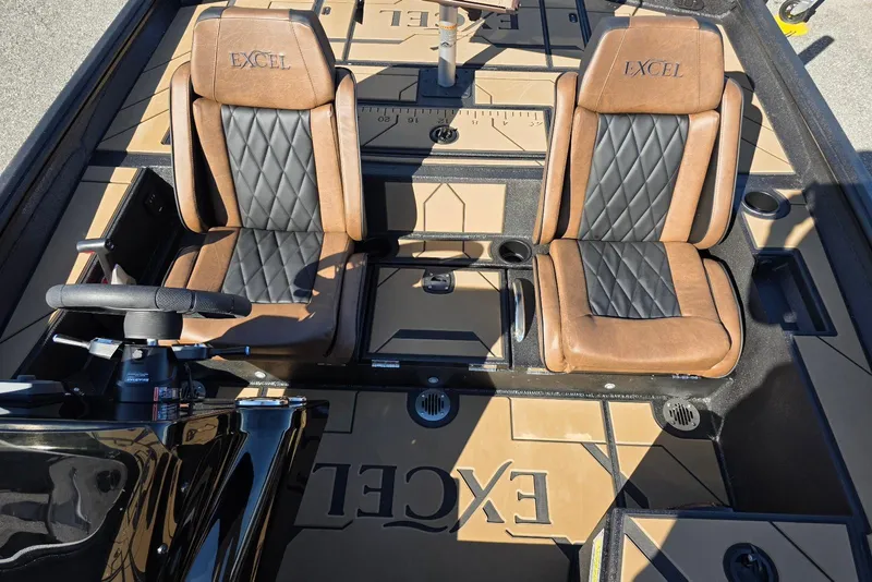 Slide: The Image of 2026 Excel EX 183 boat interior with brown and black leather seats. - 25