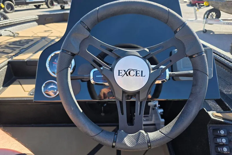 Slide: The Image of Steering wheel of 2026 Excel EX 183 boat with dashboard gauges. - 28