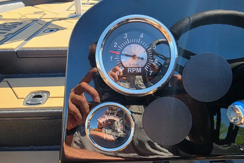 Slide: The Image of Dashboard of Excel EX 183 boat, showing RPM and fuel gauges, 2026 model. - 29