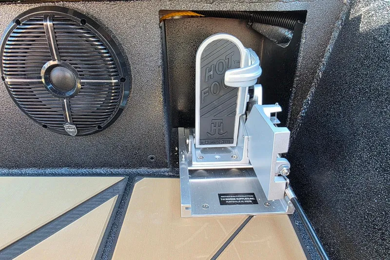Slide: The Image of Boat throttle pedal and speaker in Excel EX 183, 2026 model. - 32