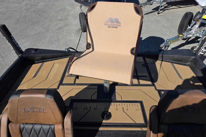 Slide: The Image of 2026 Excel EX 183 boat interior with Millennium Marine seat and brown leather accents. - 34