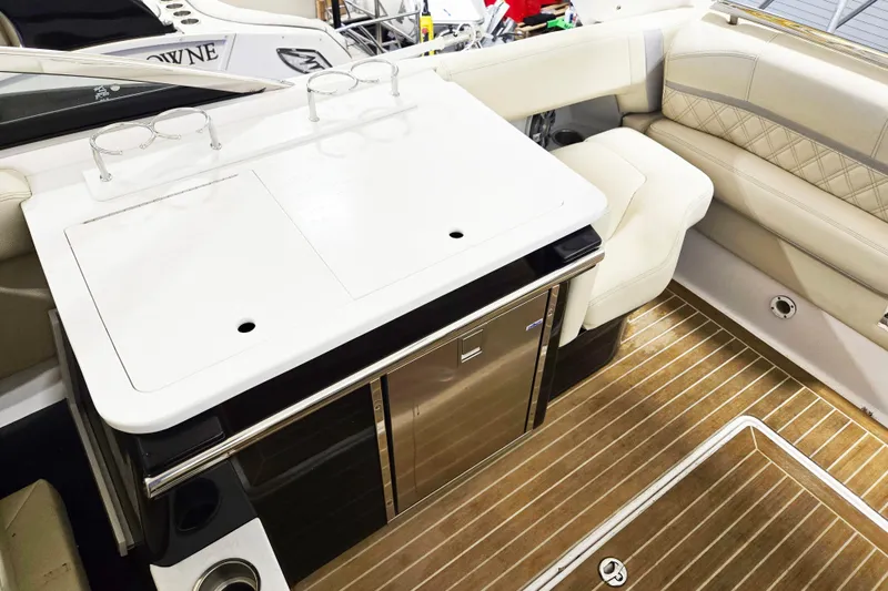 Slide: The Image of Luxurious interior of 2020 Regal 2800 Bowrider with seating and kitchenette. - 10
