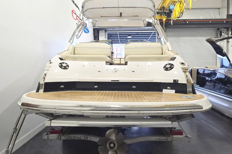 Slide: The Image of 2020 Regal 2800 Bowrider boat on trailer in indoor storage facility. - 3