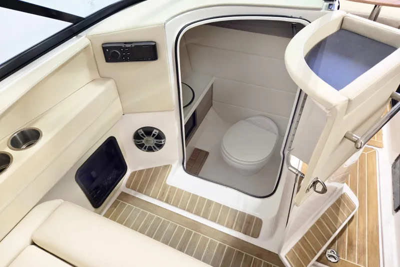 Slide: The Image of 2020 Regal 2800 Bowrider boat interior with compact bathroom and modern amenities. - 4