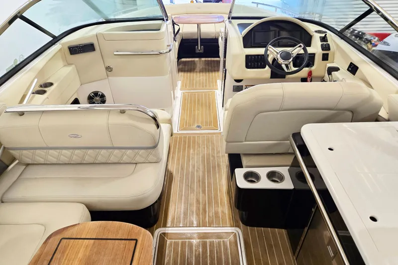 Slide: The Image of Interior of a 2020 Regal 2800 Bowrider boat with luxurious seating and modern dashboard. - 7