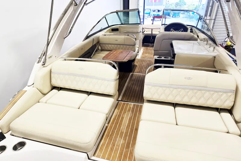 Slide: The Image of 2020 Regal 2800 Bowrider interior with luxurious seating and wooden accents. - 8