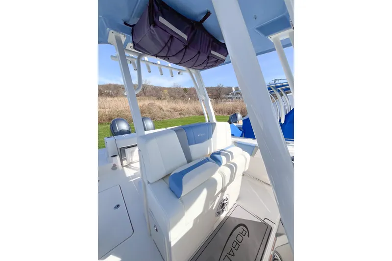 Slide: The Image of 2023 Robalo R270 Center Console boat interior with seating and storage. - 10