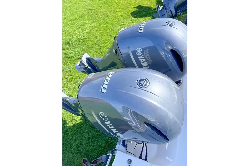Slide: The Image of Twin Yamaha 200 outboard engines on a 2023 Robalo R270 Center Console boat. - 17