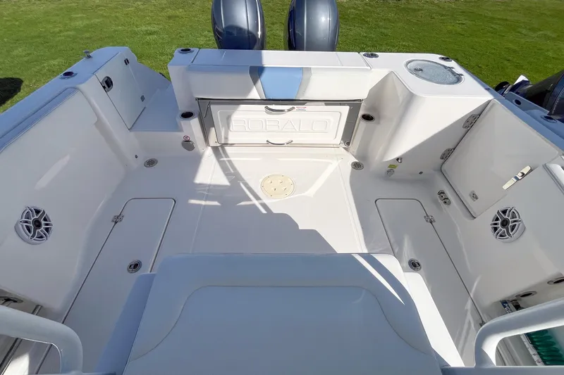 Slide: The Image of 2023 Robalo R270 Center Console boat interior with spacious deck and storage compartments. - 3