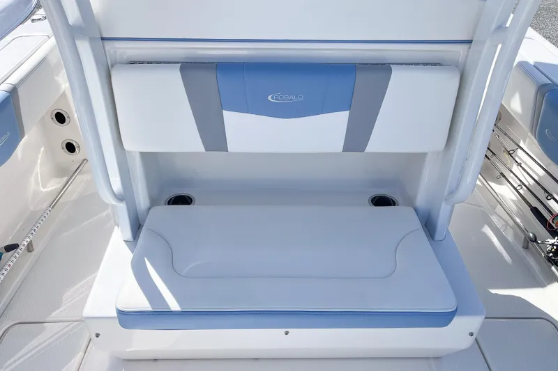 Slide: The Image of 2023 Robalo R270 Center Console boat seating with cup holders and blue accents. - 7