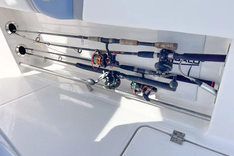 Slide: The Image of 2023 Robalo R270 Center Console fishing rod storage compartment. - 9