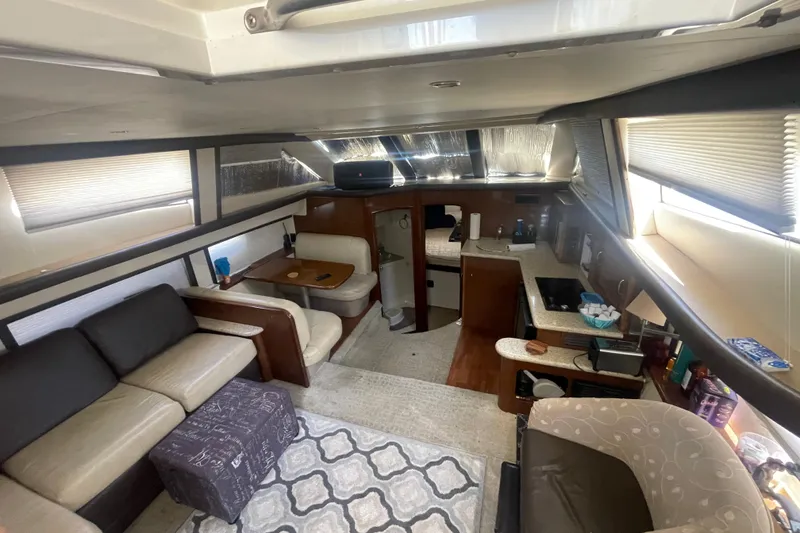 Slide: The Image of Interior of 2008 Carver 41 Cockpit Motor Yacht, featuring cozy seating and modern amenities. - 18