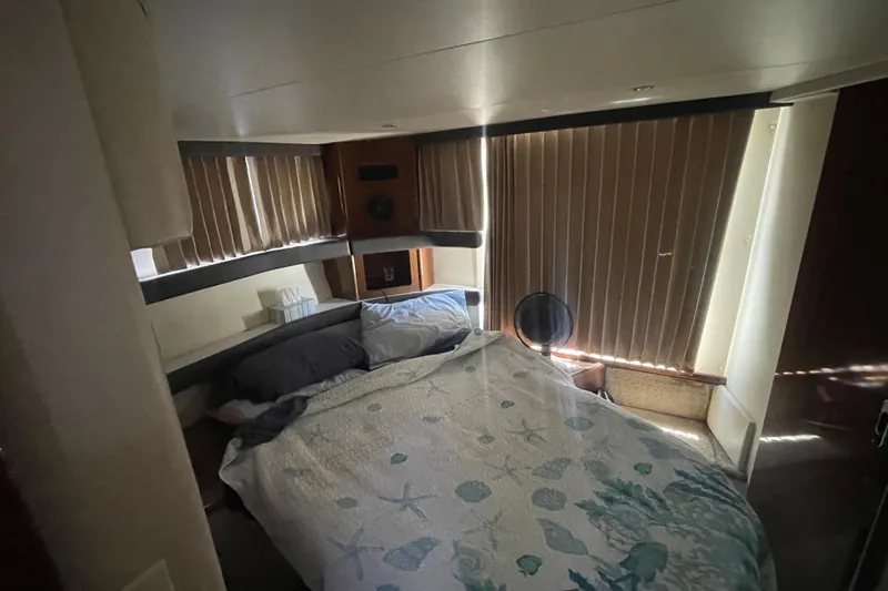 Slide: The Image of Interior cabin of 2008 Carver 41 Cockpit Motor Yacht with bed and blinds. - 30