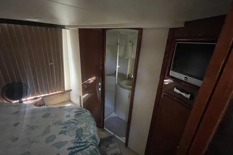 Slide: The Image of Interior of 2008 Carver 41 Cockpit Motor Yacht with bedroom and bathroom view. - 32