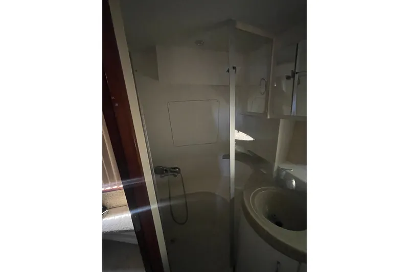 Slide: The Image of Bathroom interior of 2008 Carver 41 Cockpit Motor Yacht, featuring shower and sink. - 35