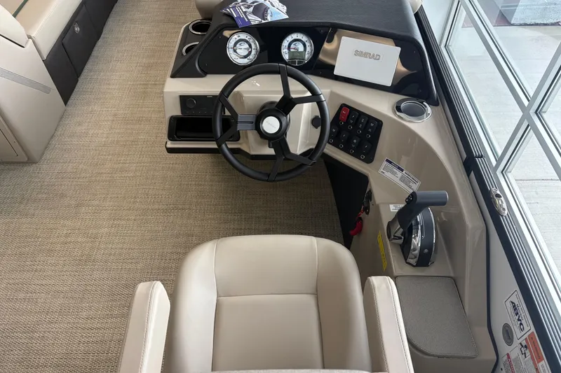 Slide: The Image of Interior view of a Crest 230SLC Conquest 2026 boat helm. - 4