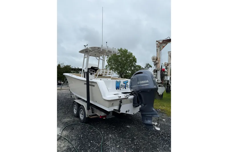 Slide: The Image of 2018 Sportsman Open 232 Center Console boat with Yamaha engine on trailer. - 3