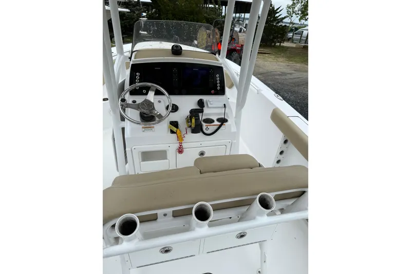 Slide: The Image of 2018 Sportsman Open 232 Center Console boat interior with steering wheel and controls. - 5