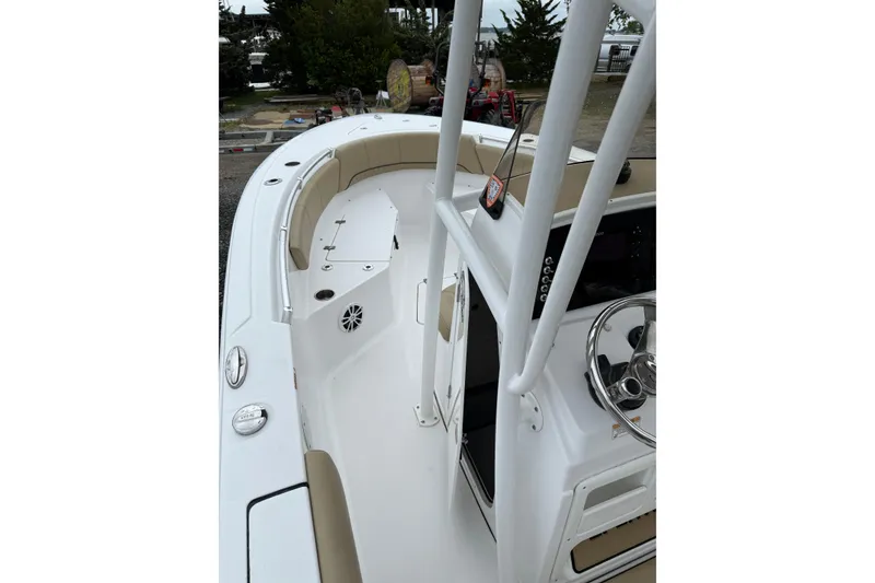 Slide: The Image of 2018 Sportsman Open 232 Center Console boat interior with steering wheel and seating. - 7