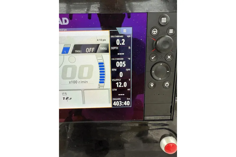 Slide: The Image of Close-up of a 2018 Sportsman Open 232 Center Console boat's control panel display. - 9