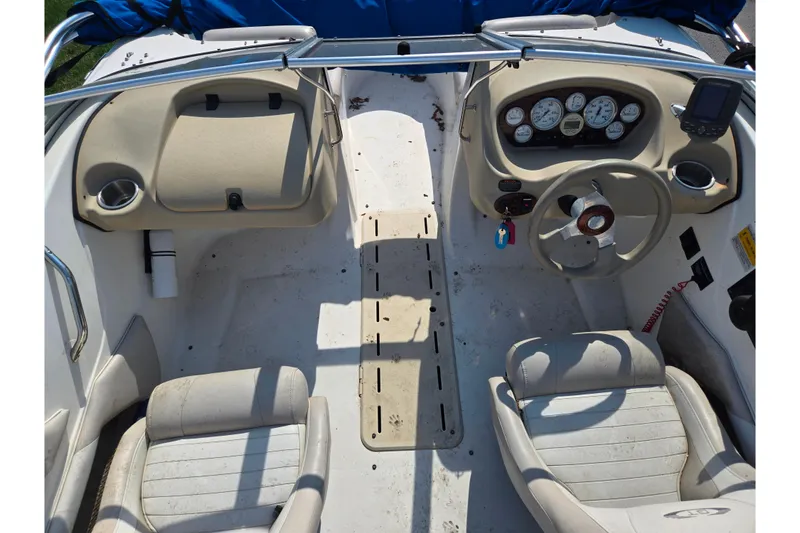 Slide: The Image of Interior of a 2007 Glastron GT 185 boat showing dashboard and seating. - 11
