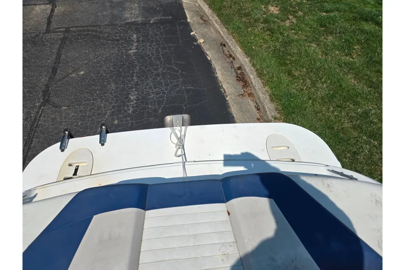 Slide: The Image of 2007 Glastron GT 185 boat stern view on pavement and grass. - 25