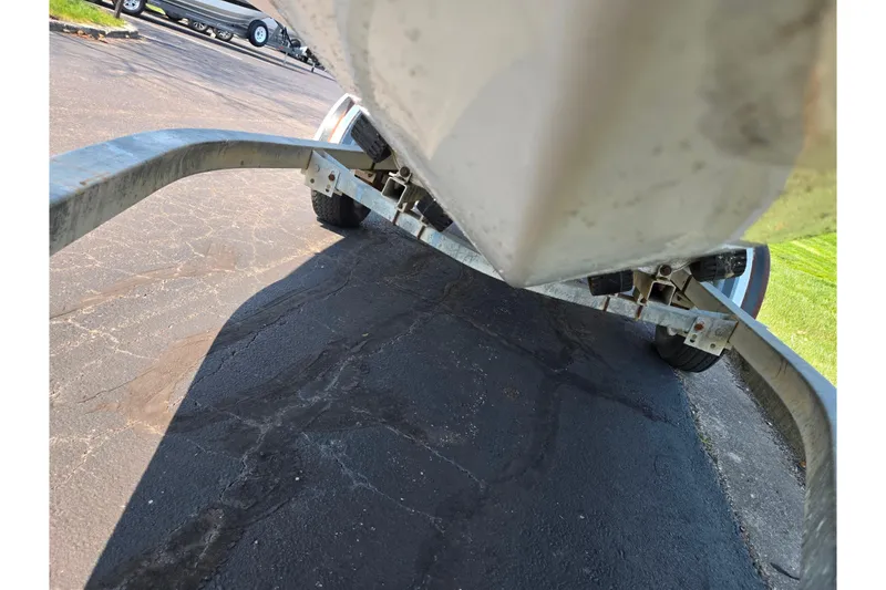 Slide: The Image of Trailer view of a 2007 Glastron GT 185 boat on pavement. - 7