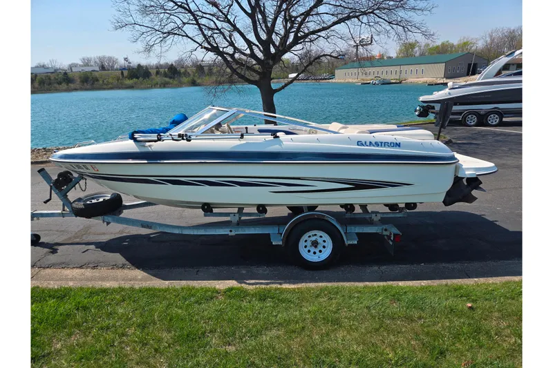 Slide: The Image of 2007 Glastron GT 185 boat on trailer by a lake, sunny day. - 9