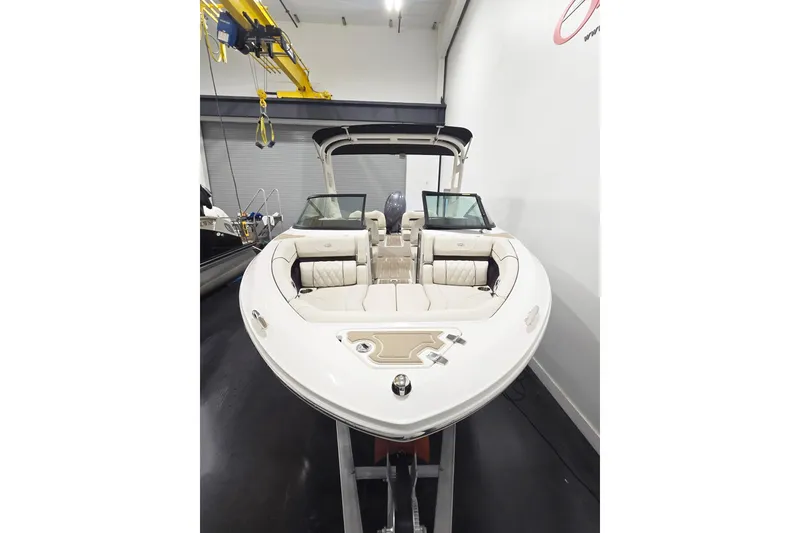 Slide: The Image of 2026 Regal LX2 boat with luxurious seating in a showroom setting. - 3