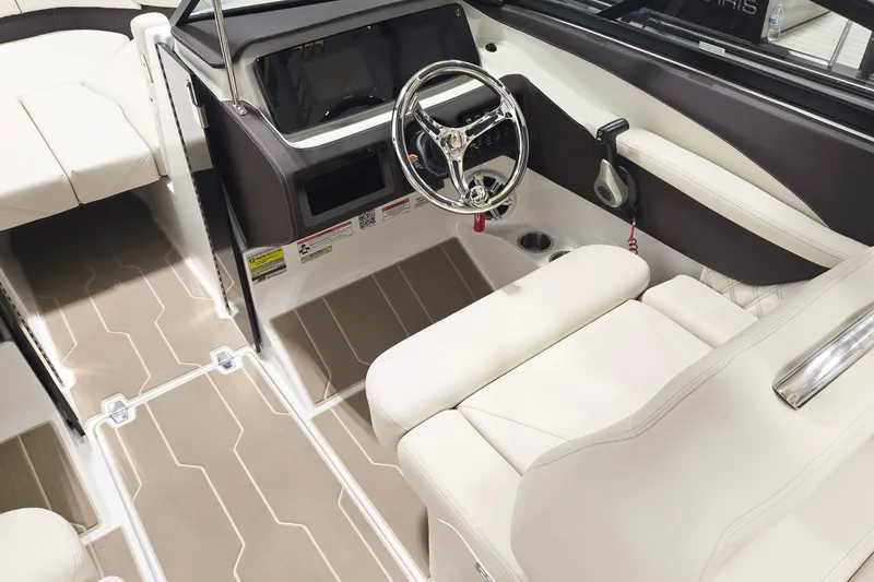Slide: The Image of Interior of 2026 Regal LX2 boat with modern steering and luxurious seating. - 6