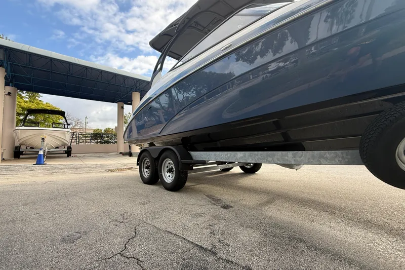 Slide: The Image of 2018 Yamaha Boats 242 Limited S E-Series on trailer under blue canopy. - 10