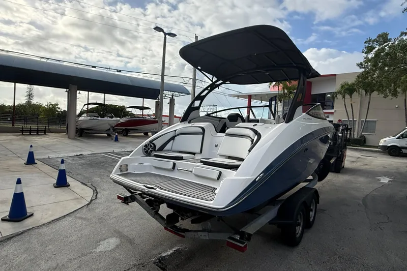 Slide: The Image of 2018 Yamaha Boats 242 Limited S E-Series on trailer, outdoor display setting. - 13