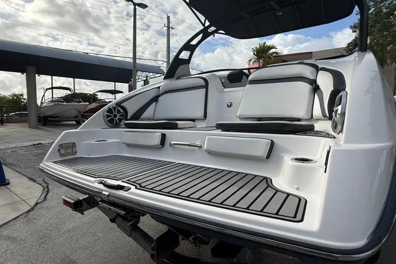 Slide: The Image of 2018 Yamaha Boats 242 Limited S E-Series, rear view with seating and speakers. - 14