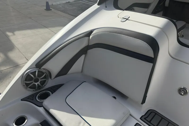 Slide: The Image of Interior of 2018 Yamaha Boats 242 Limited S E-Series, featuring sleek seating and speaker system. - 18