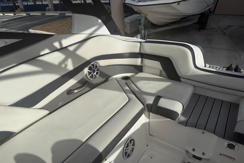 Slide: The Image of Interior seating of a 2018 Yamaha Boats 242 Limited S E-Series, featuring sleek design and speaker system. - 21