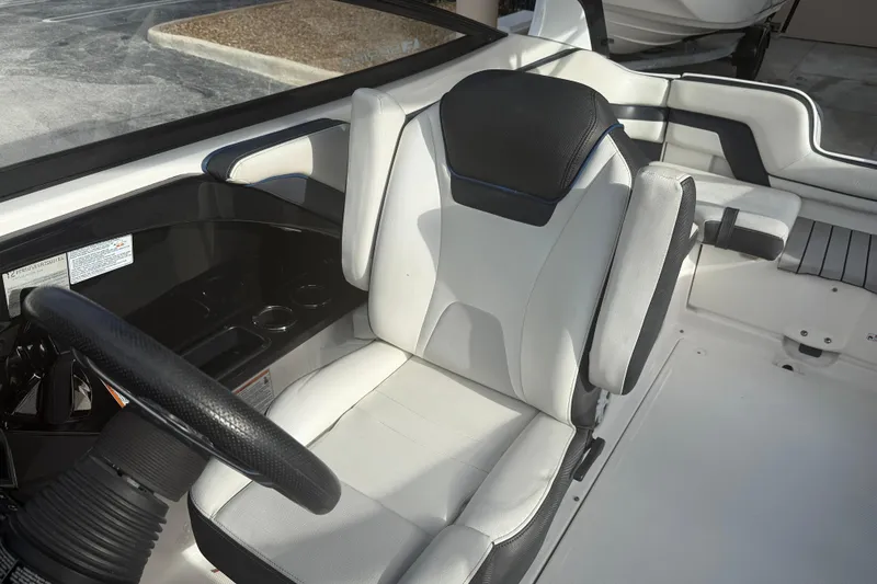 Slide: The Image of Captain's seat of 2018 Yamaha Boats 242 Limited S E-Series, featuring sleek design and controls. - 25